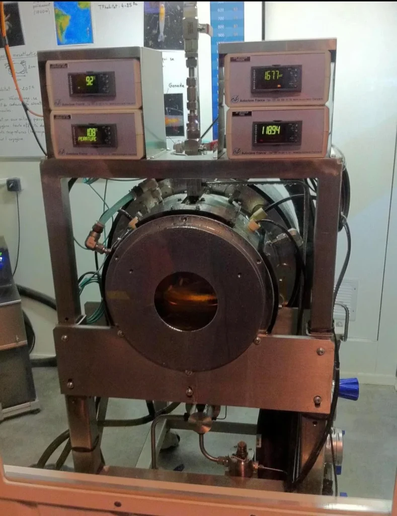 Abyss Box Abyss Box high-pressure marine habitat system showing stainless steel pressure vessel with transparent viewport and control equipment in IFREMER laboratory
