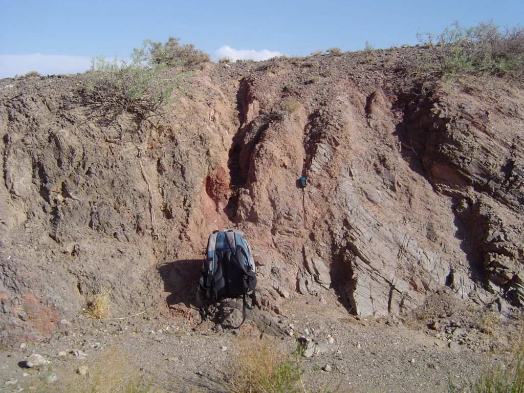 8 Metamorphic Minerals and Metamorphic Rocks Metamorphism along a fault zone. Knapsack for scale.