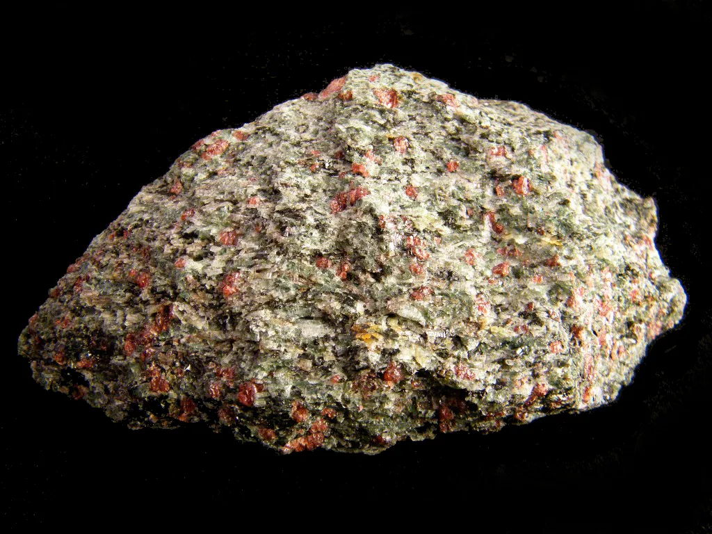 8 Metamorphic Minerals and Metamorphic Rocks Green omphacite and red pyrope from Nordfjord, Norway. The specimen is 10 cm across