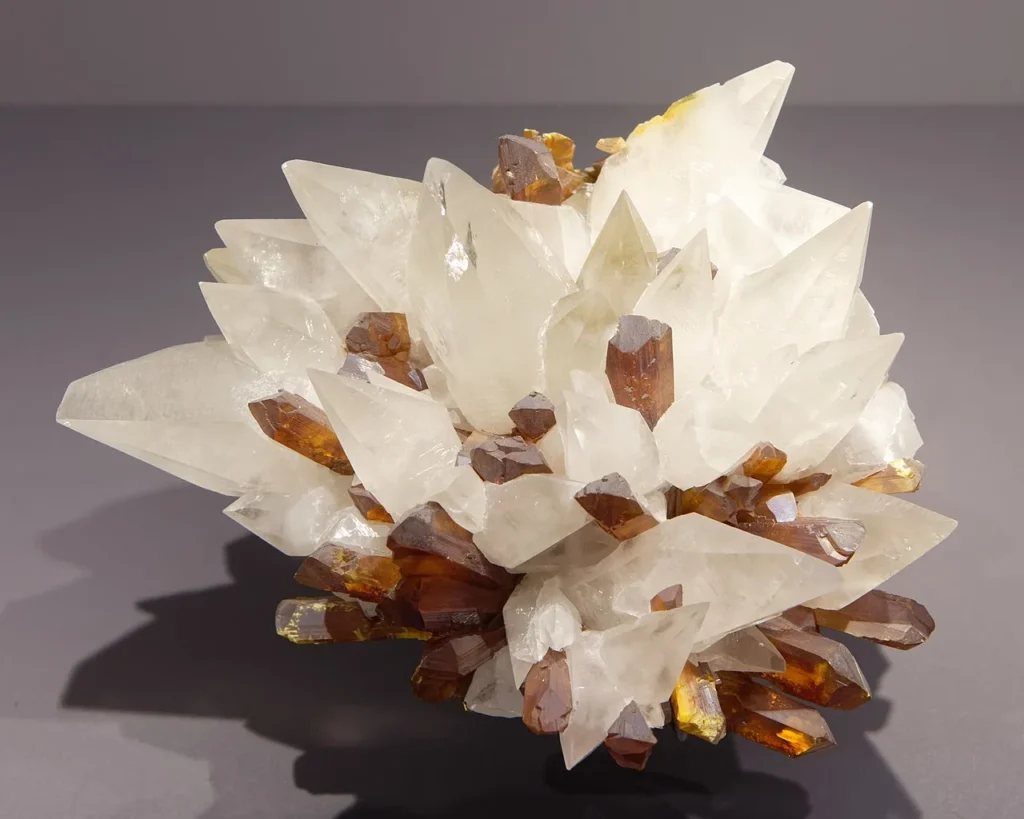 3 Mineral Properties Dogtooth spar on top of orpiment