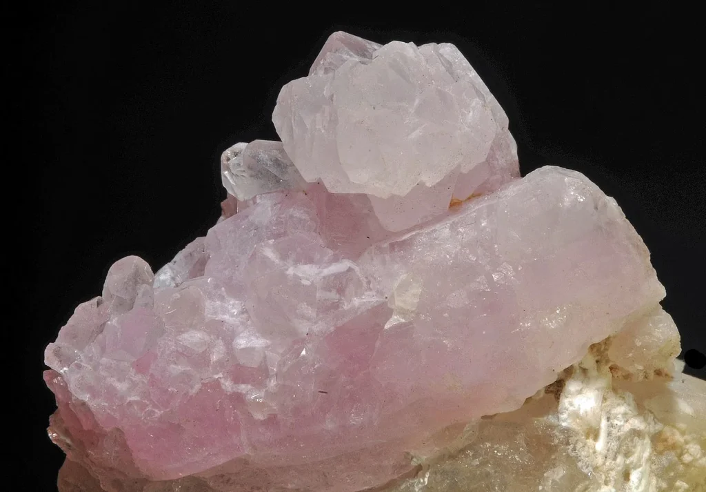 3 Mineral Properties Rose quartz on top of clear quartz