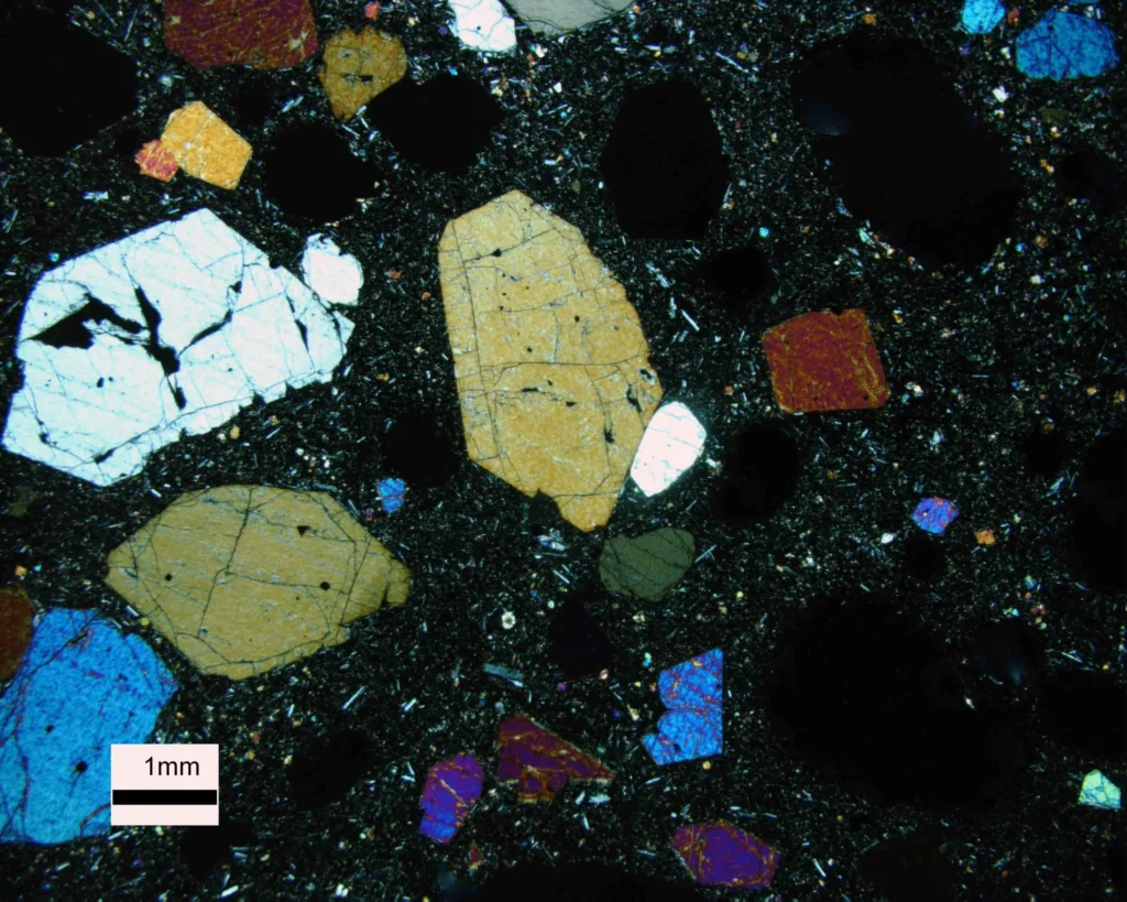 4 Crystals and Crystallization Olivine and pyroxene crystals surrounded by glass
