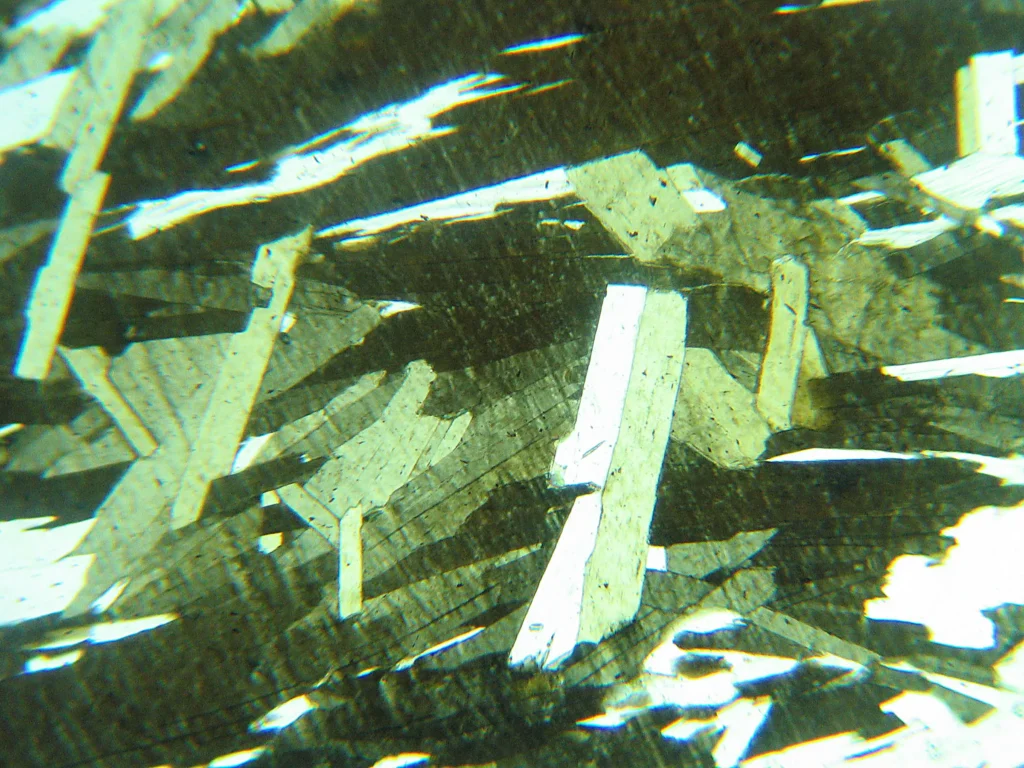 5 Optical Mineralogy Thin section view of a rock containing (mostly) biotite, muscovite, and quartz (PP light)