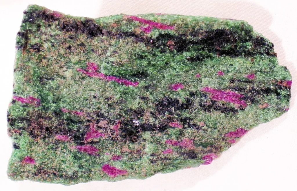 8 Metamorphic Minerals and Metamorphic Rocks  Metamorphic rock from Tanzania containing green zoisite, red corundum, and black hornblende