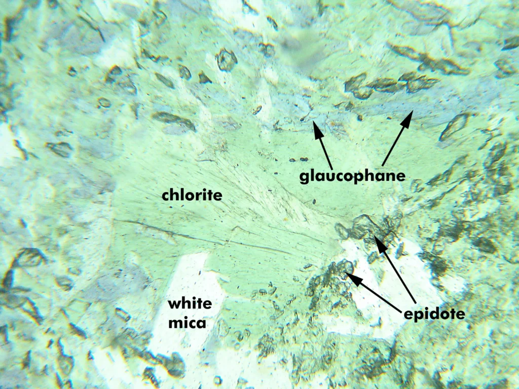 5 Optical Mineralogy Glaucophane, epidote, white mica, and chlorite in a blueschist from Panoche Pass, California (PP light)