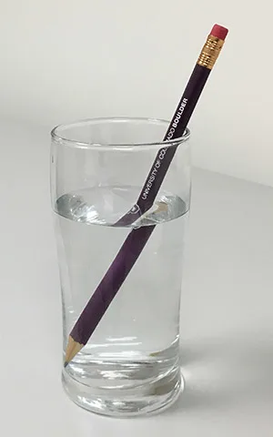 5 Optical Mineralogy Light refraction caused by a glass of water