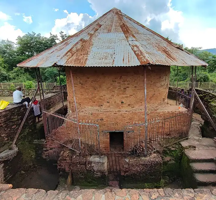 Maniyar Math in Rajgir, Bihar, is an ancient, cylindrical brick structure dating to the Gupta period, significant to Jain, Hindu, and Buddhist traditions, known for its association with Naga (serpent) worship and King Jarasandha, featuring unique architecture with niches for deities and a deep, well-like core. Discovered by Alexander Cunningham and fully excavated by Theodor Bloch, it's a historical site showcasing ancient religious practices and is located near the hot springs and Bimbisara Jail. 