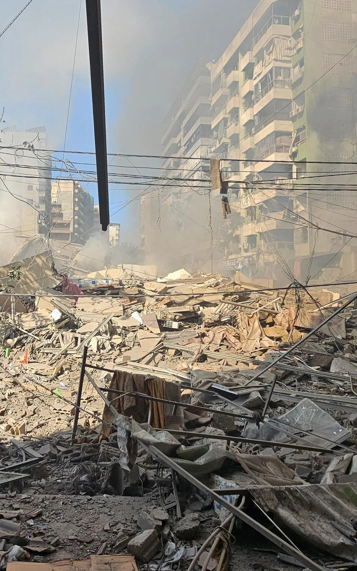 Beirut chokes on smoke and fire; Israeli strikes tear through its heart.