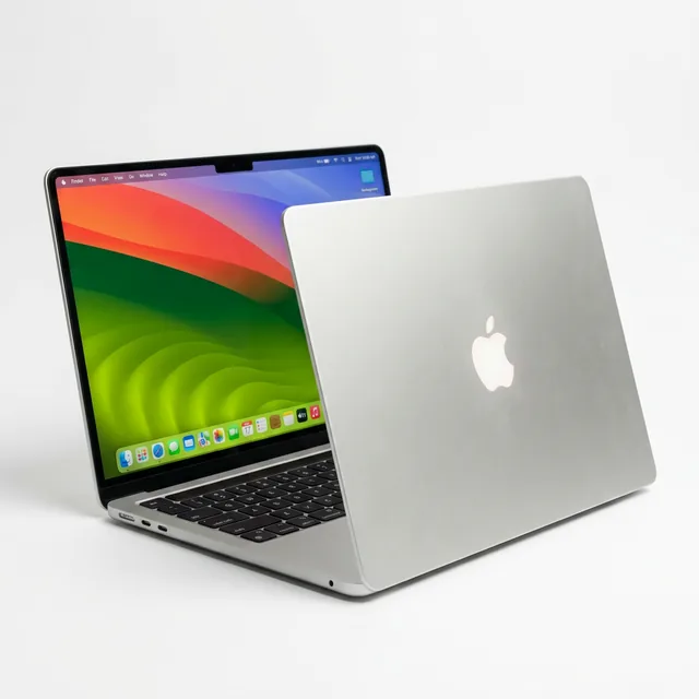 Apple MacBook Neo laptop open on a white background showing the 13-inch Liquid Retina display with macOS, silver aluminum body, color-matched Magic Keyboard, and Apple logo on the lid