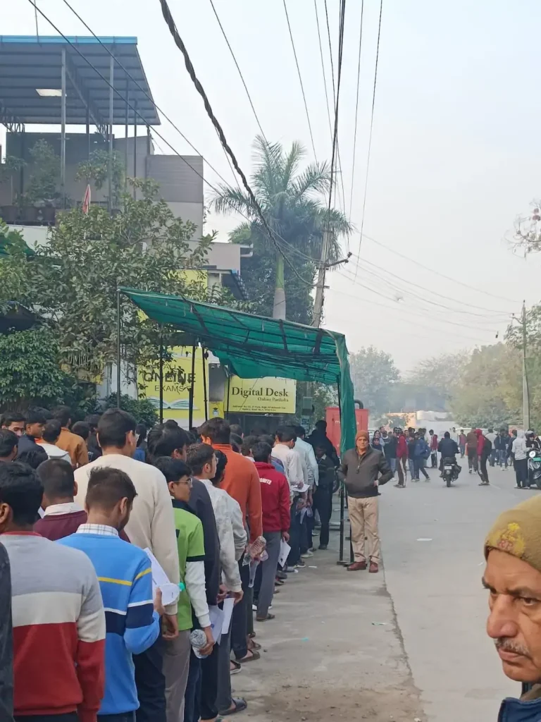 A student anxiously checking their laptop for the JEE Main 2026 Session 2 city intimation slip update from StudyHub.