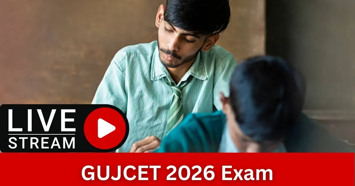 A student carefully filling out an OMR answer sheet during the GUJCET 2026 entrance exam with a pen and admit card on the desk.
