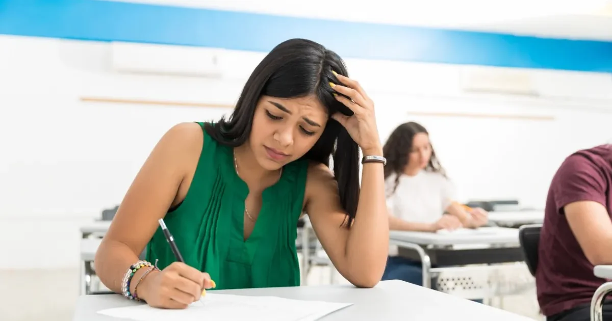 A student anxiously checking their revised MAH MCA CET 2026 admit card on a laptop after the last-minute exam center change announcement.
