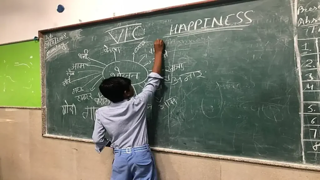 An overcrowded classroom in a Delhi school with many students sitting closely together, highlighting the school infrastructure crisis.