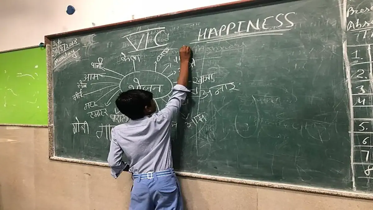 An overcrowded classroom in a Delhi school with many students sitting closely together, highlighting the school infrastructure crisis.