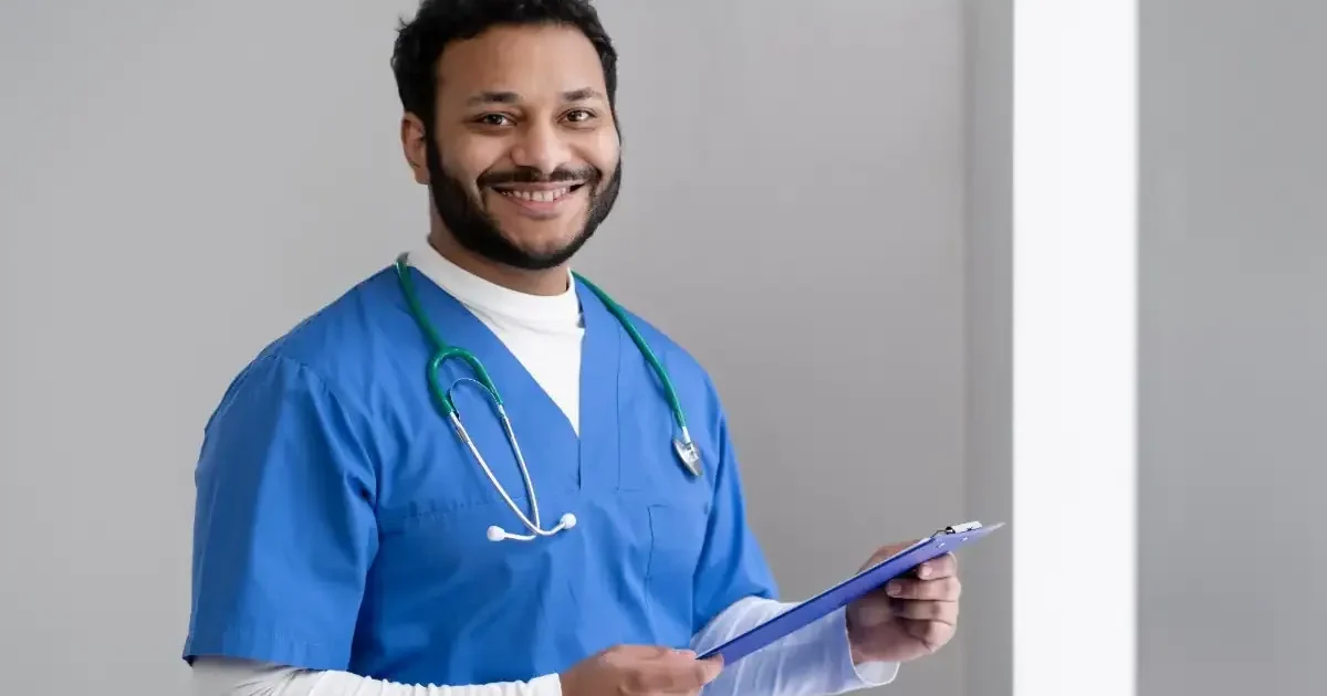 A nursing student in a uniform carefully preparing a medical instrument, representing the WB ANM GNM 2026 nursing entrance exam.