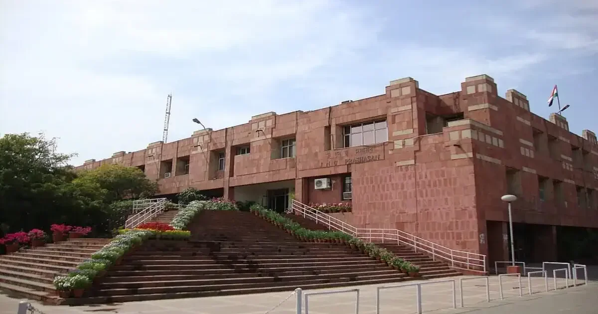 The iconic administrative block of Jawaharlal Nehru University (JNU) campus on a bright day, symbolizing the recent faculty promotions.