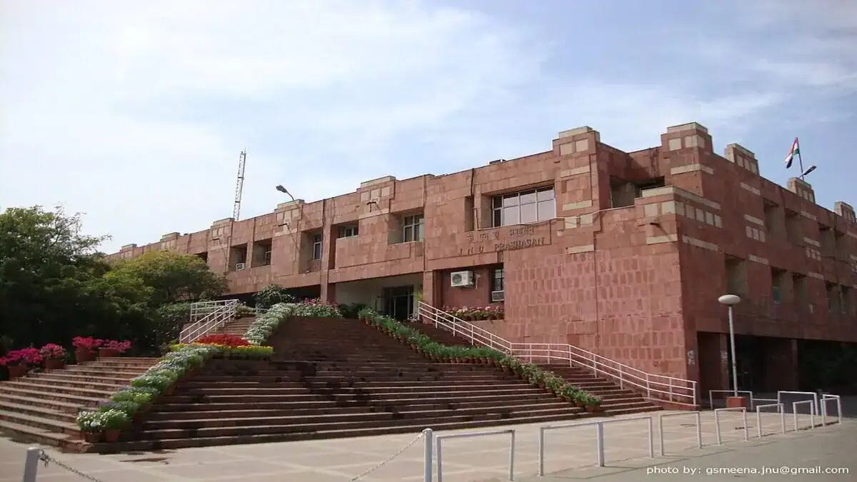 JNU's Record-Breaking Move: Hundreds of Faculty Promoted! The iconic administrative block of Jawaharlal Nehru University (JNU) campus on a bright day, symbolizing the recent faculty promotions.