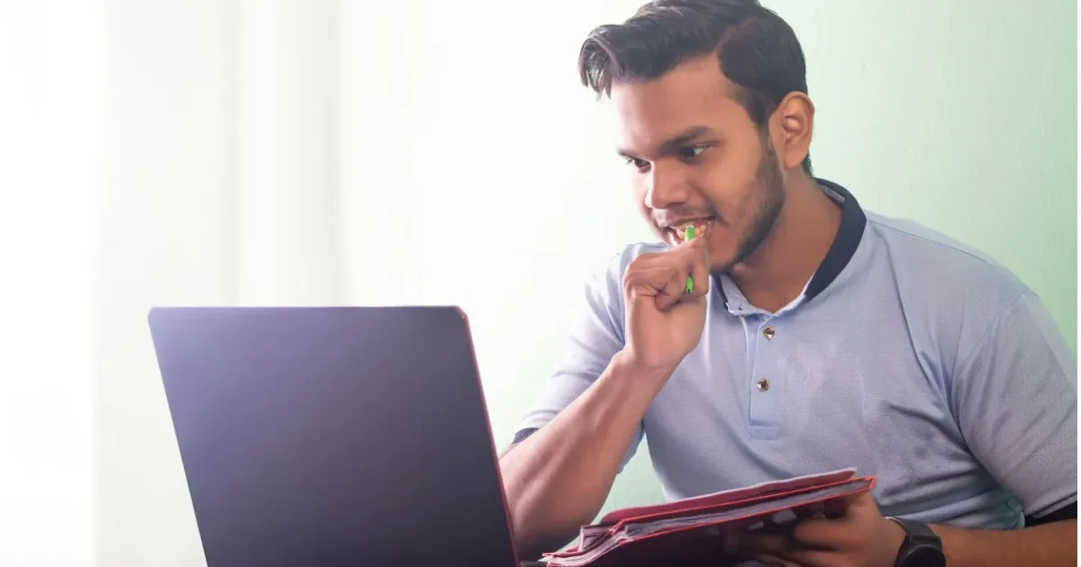 A student anxiously checks their laptop for the NTA CUET UG 2026 schedule and exam dates announcement.