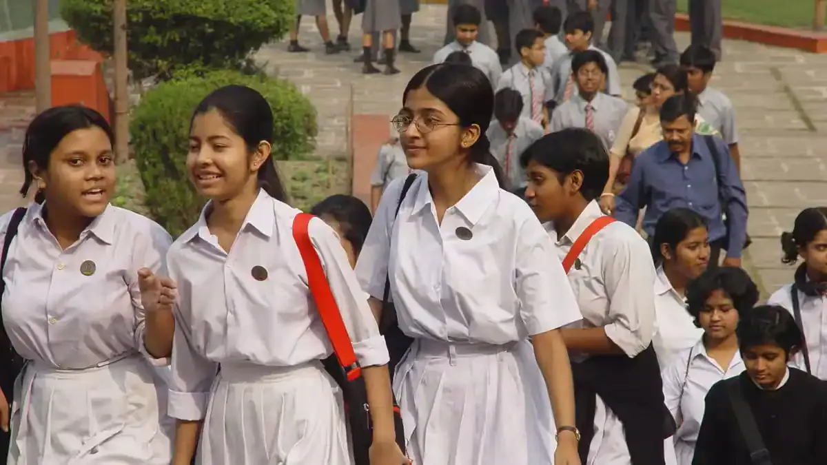 A student anxiously checking their Bihar Board 12th Result 2026 on a laptop, looking relieved and happy.