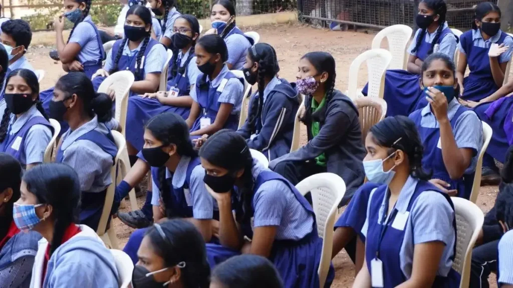 Students writing the AP SSC English Paper 2026 in a classroom exam hall, focused on their answer sheets.
