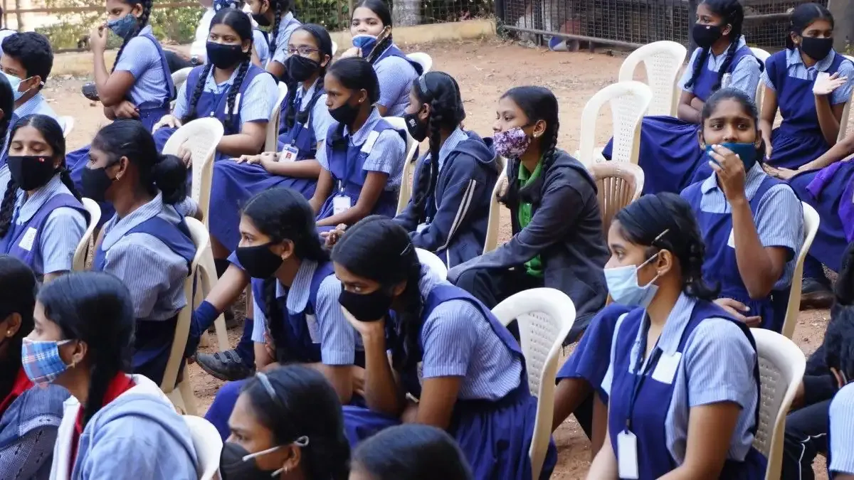 Students writing the AP SSC English Paper 2026 in a classroom exam hall, focused on their answer sheets.