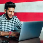 A student carefully reviewing the RRB ALP Answer Key 2026 on a laptop screen with the StudyHub logo visible.
