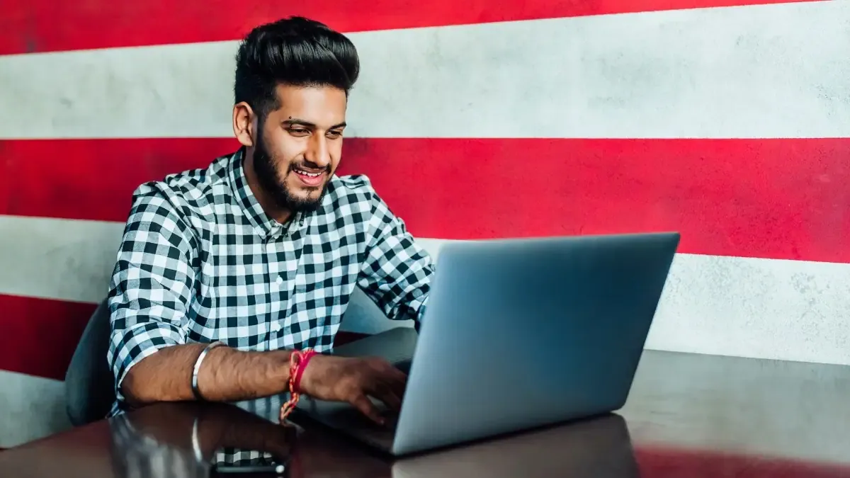 A student carefully reviewing the RRB ALP Answer Key 2026 on a laptop screen with the StudyHub logo visible.