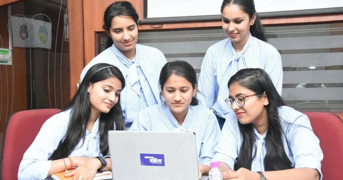 A happy student checking the RBSE 10th Result 2026 on a laptop, celebrating their success with a smile.