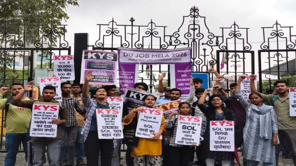 Students protesting with banners outside a University of Delhi campus building during the controversial job mela.
