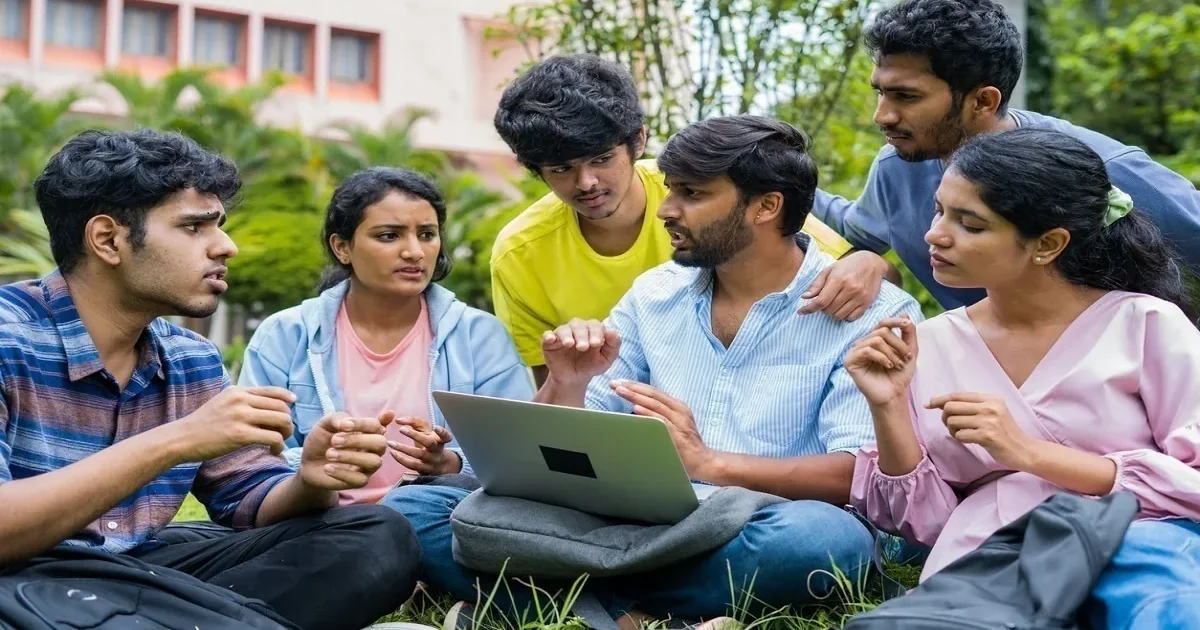 A student looking thoughtfully at a laptop screen displaying the IIT JAM 2026 counselling registration portal.