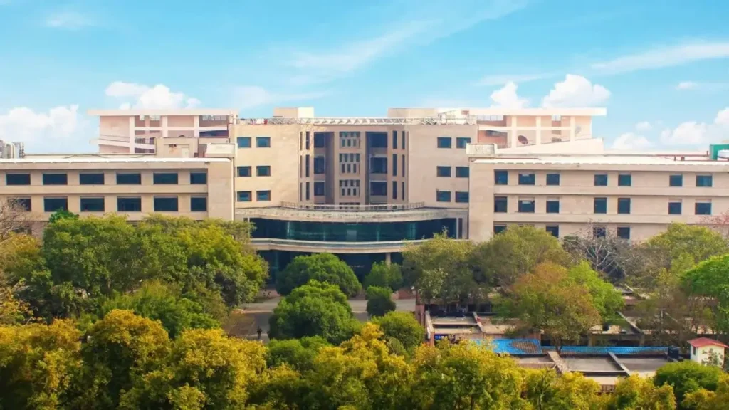 Main entrance gate of the Indian Institute of Technology (IIT) campus with students walking in, signifying the start of the 2026 admission season.