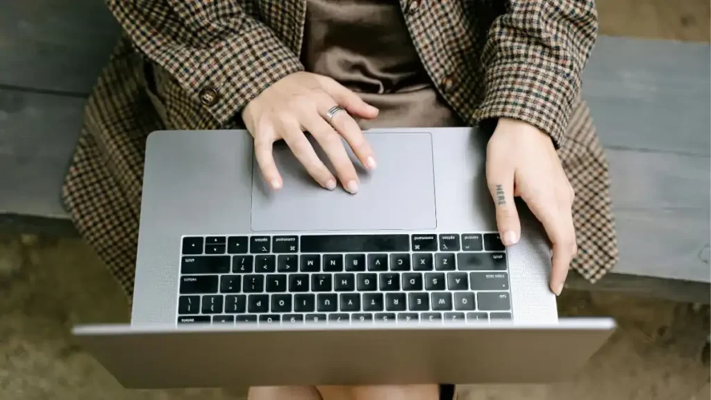Students and faculty attending a modern, eco-friendly international conference on sustainability at a university campus.