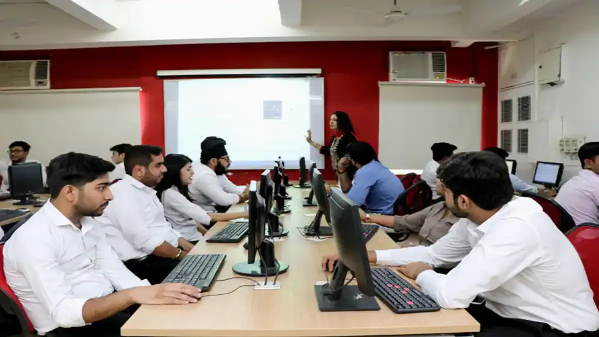 A group of smiling management students in professional attire celebrating their successful campus placements at NDIM.