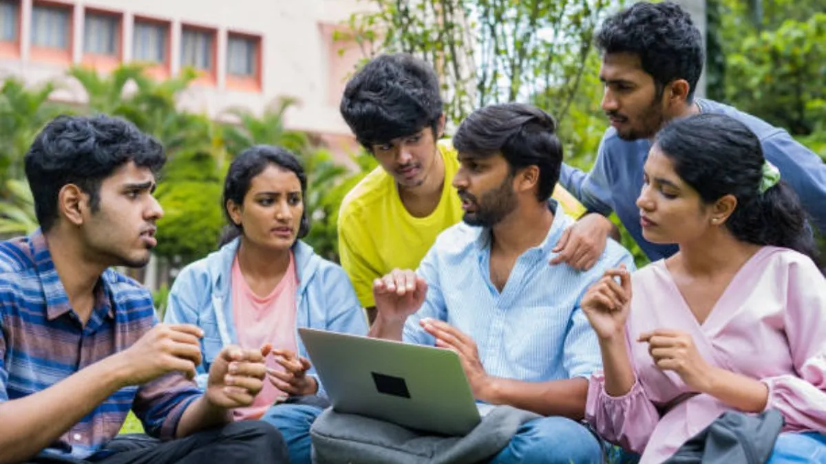 A student looking at their laptop screen for the BITSAT 2026 city slip, with a checklist graphic of common mistakes to avoid.