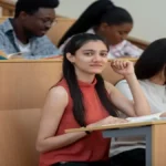 A student looking relieved while filling out the COMEDK UGET 2026 application form on a laptop, with a calendar showing the new deadline.