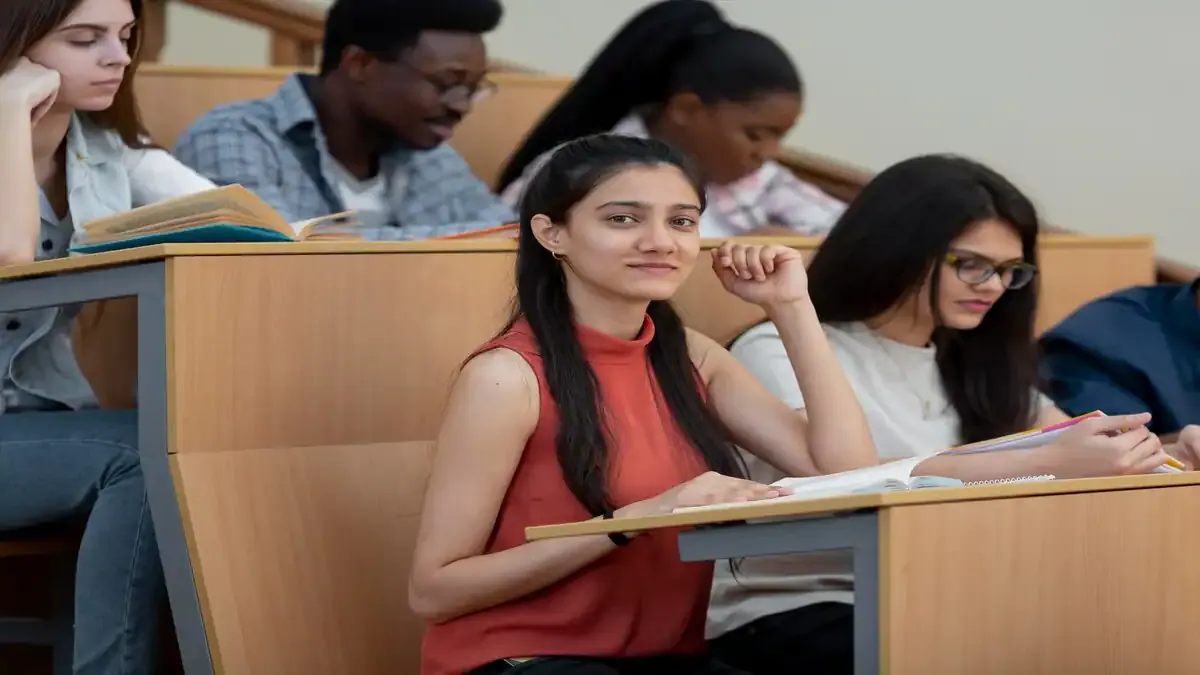 A student looking relieved while filling out the COMEDK UGET 2026 application form on a laptop, with a calendar showing the new deadline.