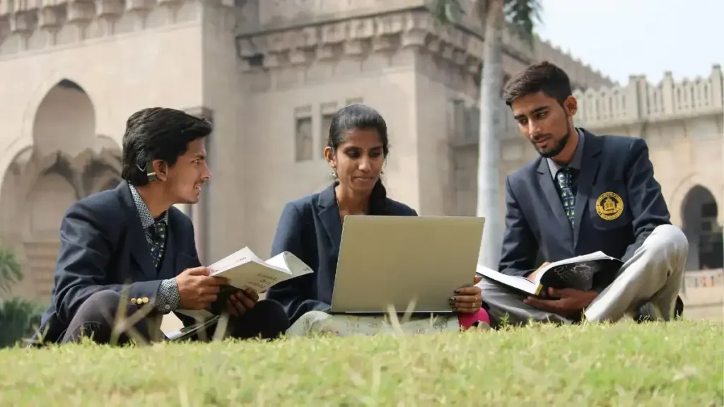 A student checking their Goa HSSC Result 2026 on a laptop, looking relieved and happy with their Class 12 scores.