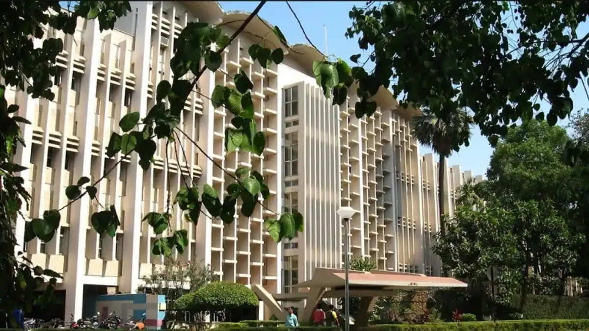 The iconic main building of IIT Bombay with a clear blue sky, representing the start of the 2026 postgraduate admission season.