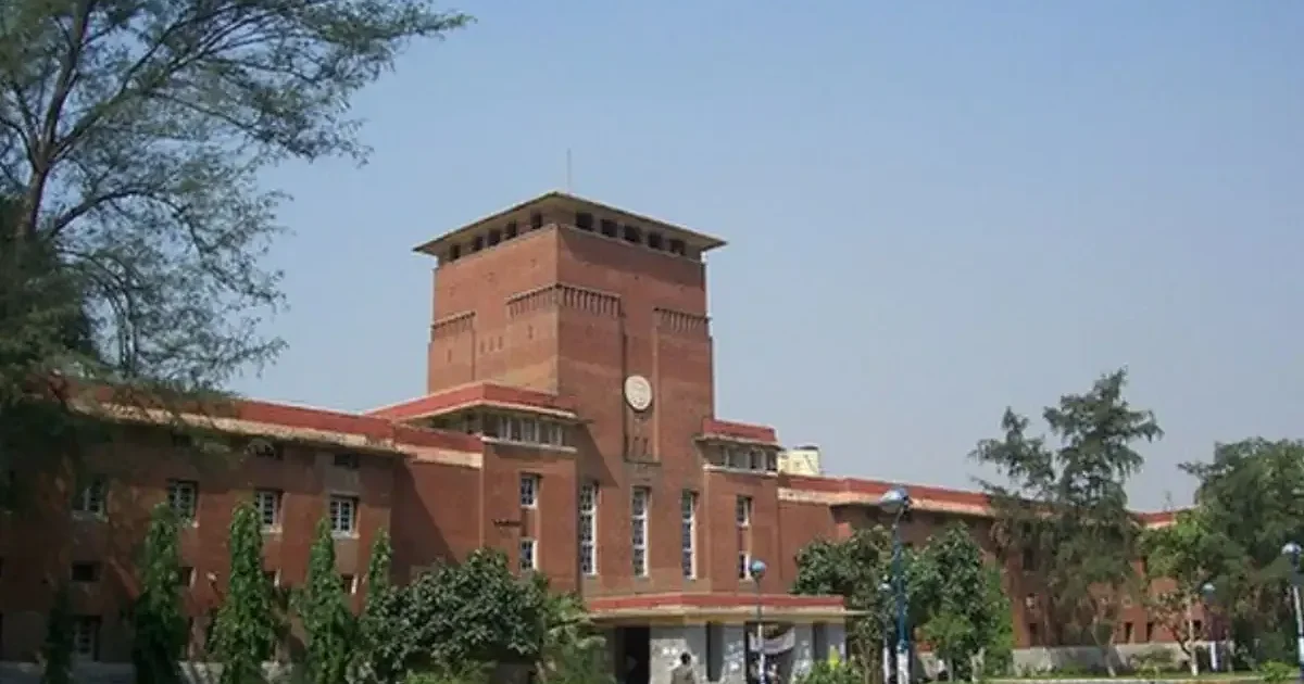 Delhi University Vice Chancellor inaugurating the new 'Prerna Bhawan' student center building with DUSU officials present.