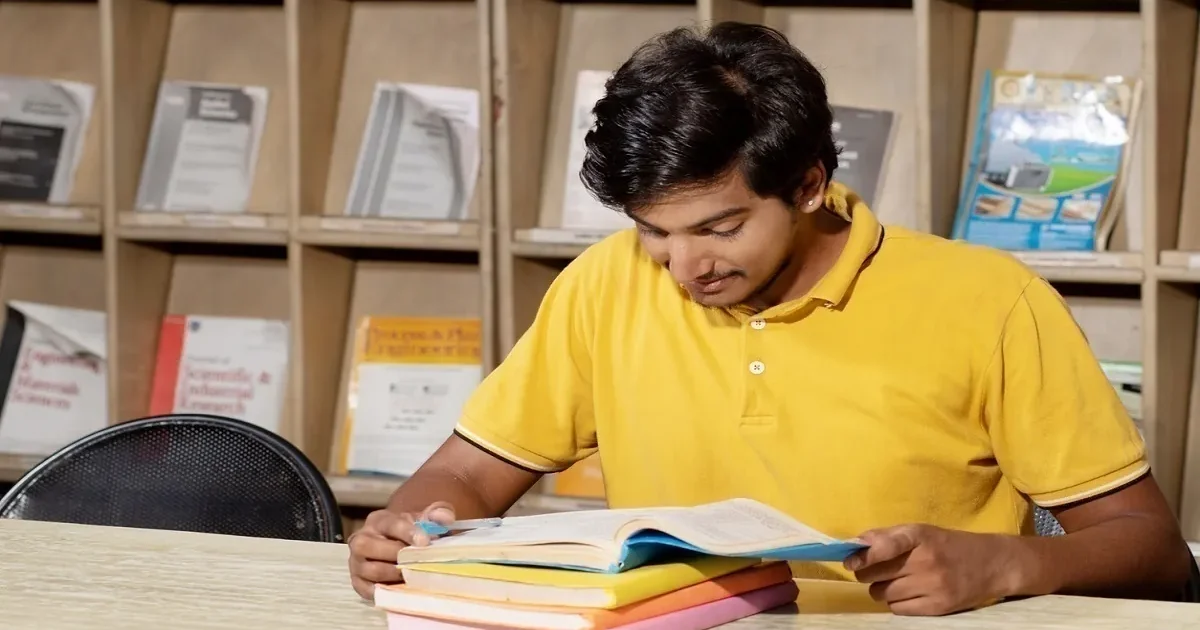 A student looking determined while studying for the SSC CGL 2026 competitive exam with the StudyHub logo visible.