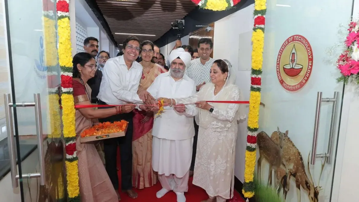 IIT's New Secret to Beat Stress? A serene image of the IIT Madras campus building with students walking by, representing the new focus on student wellness and spirituality.