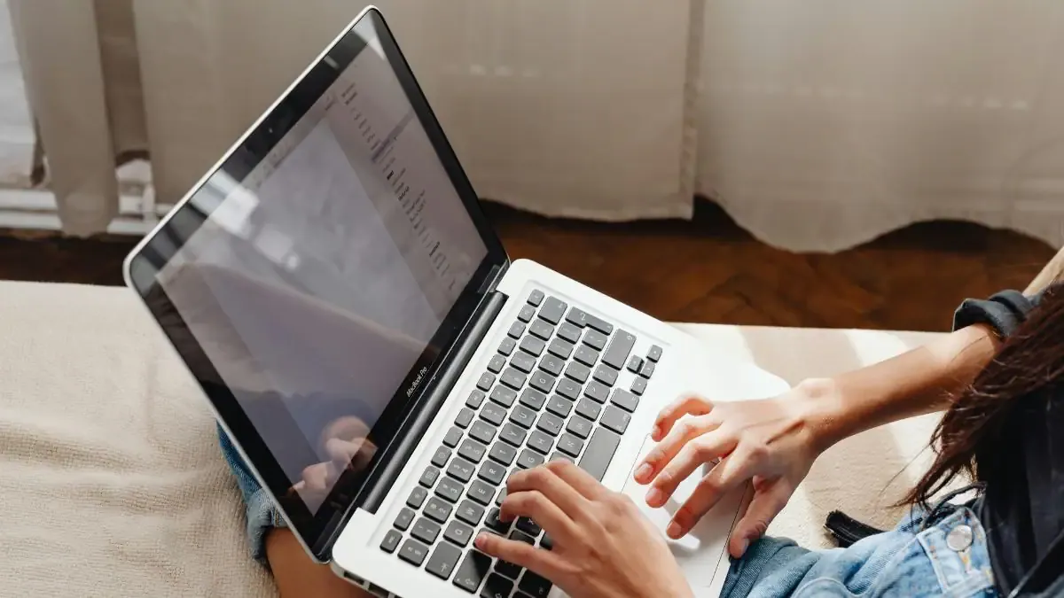 NIFTEE 2026 Results Live! Check Your Scorecard Now A student checking their NIFTEE 2026 Result on a laptop screen, looking relieved and happy.