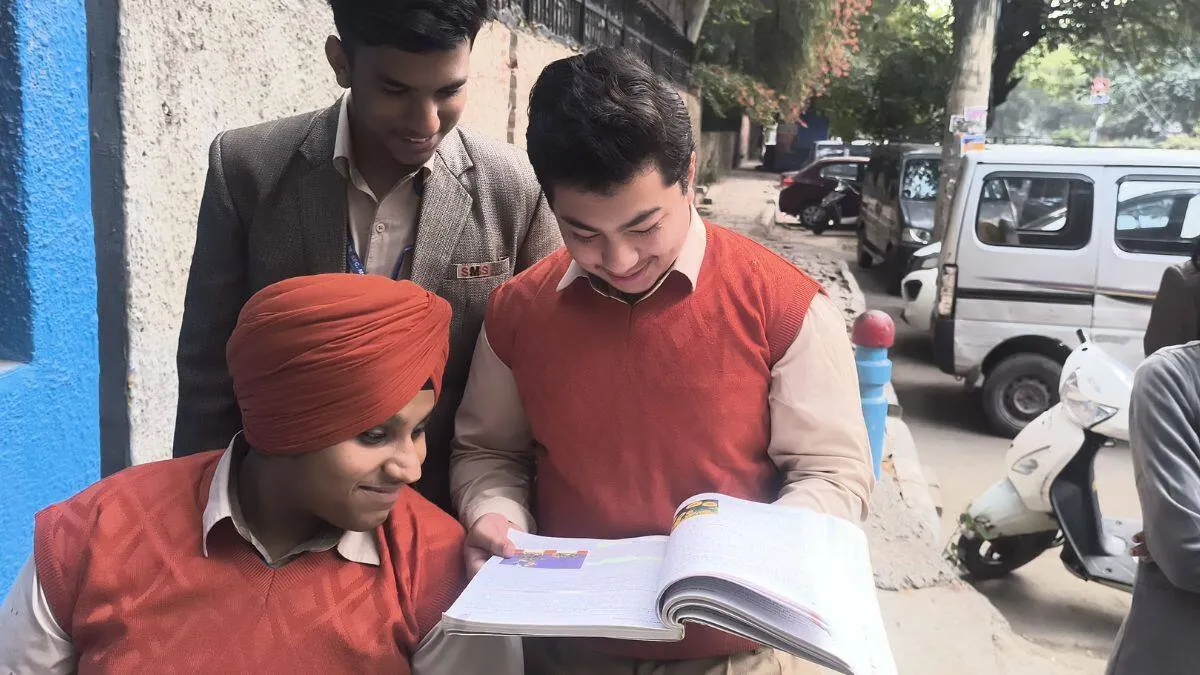 CBSE CS Paper: Easy Pass or Tough Challenge? Find Out! A student looking thoughtfully at a computer screen during the CBSE Class 12 Computer Science board examination.