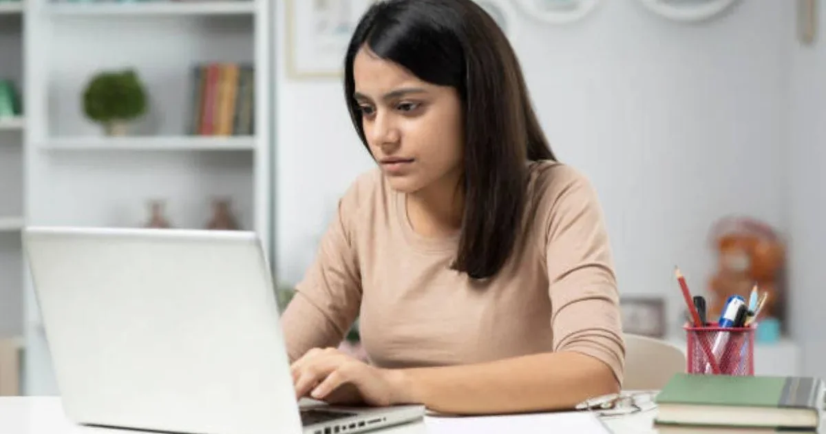 Anxious student checking their laptop for the JEE Main 2026 Session 2 admit card update from NTA.